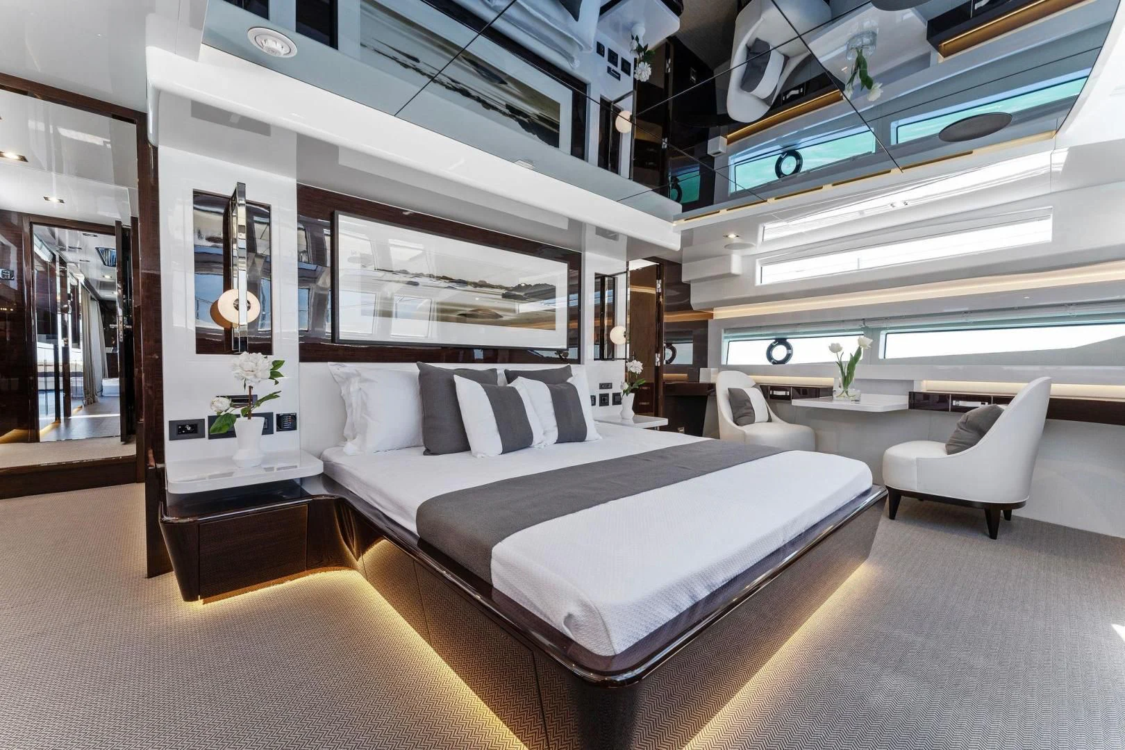 a room with a bed and a couch aboard PEARL Yacht for Sale
