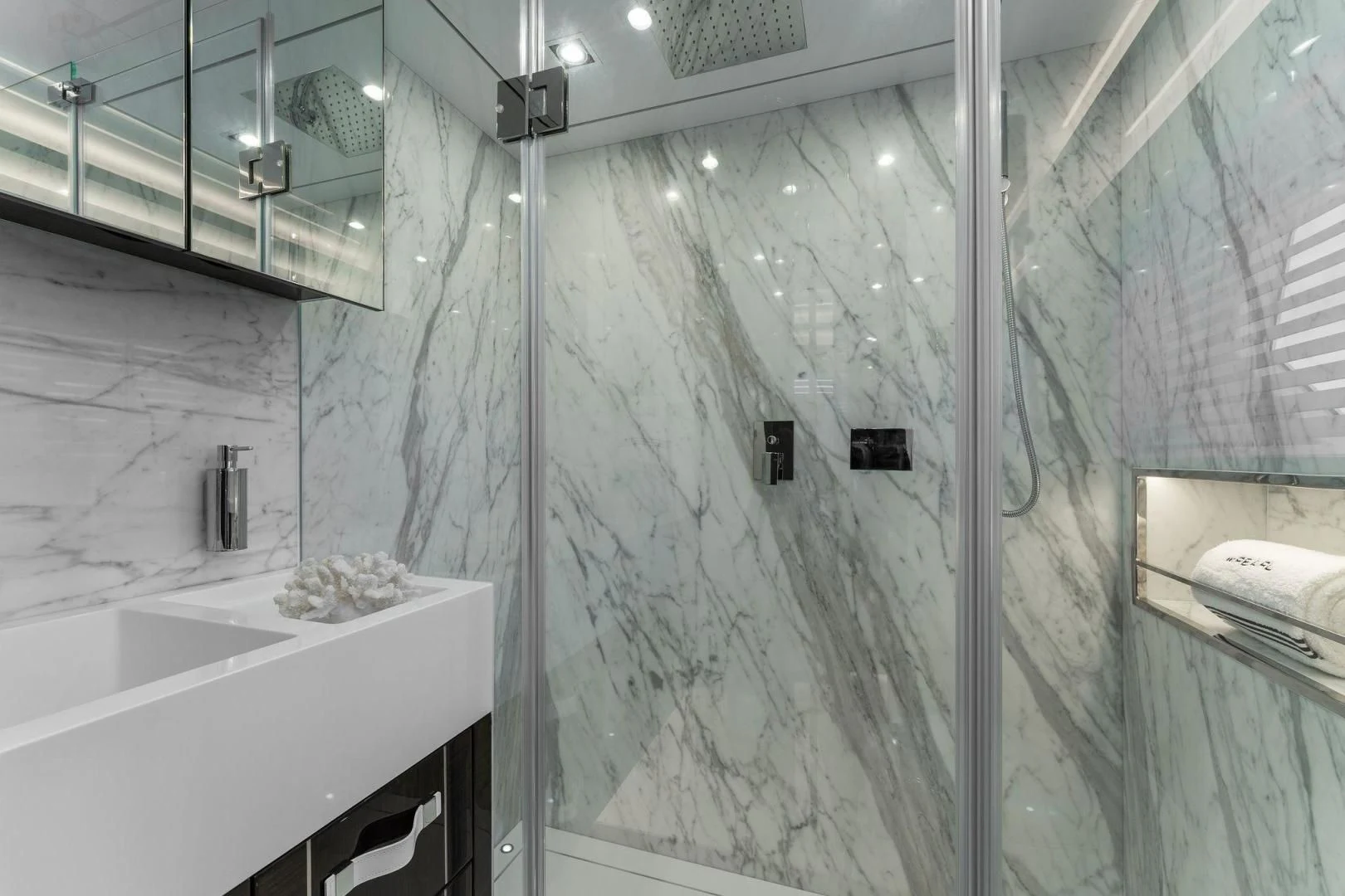 a bathroom with a glass shower aboard PEARL Yacht for Sale