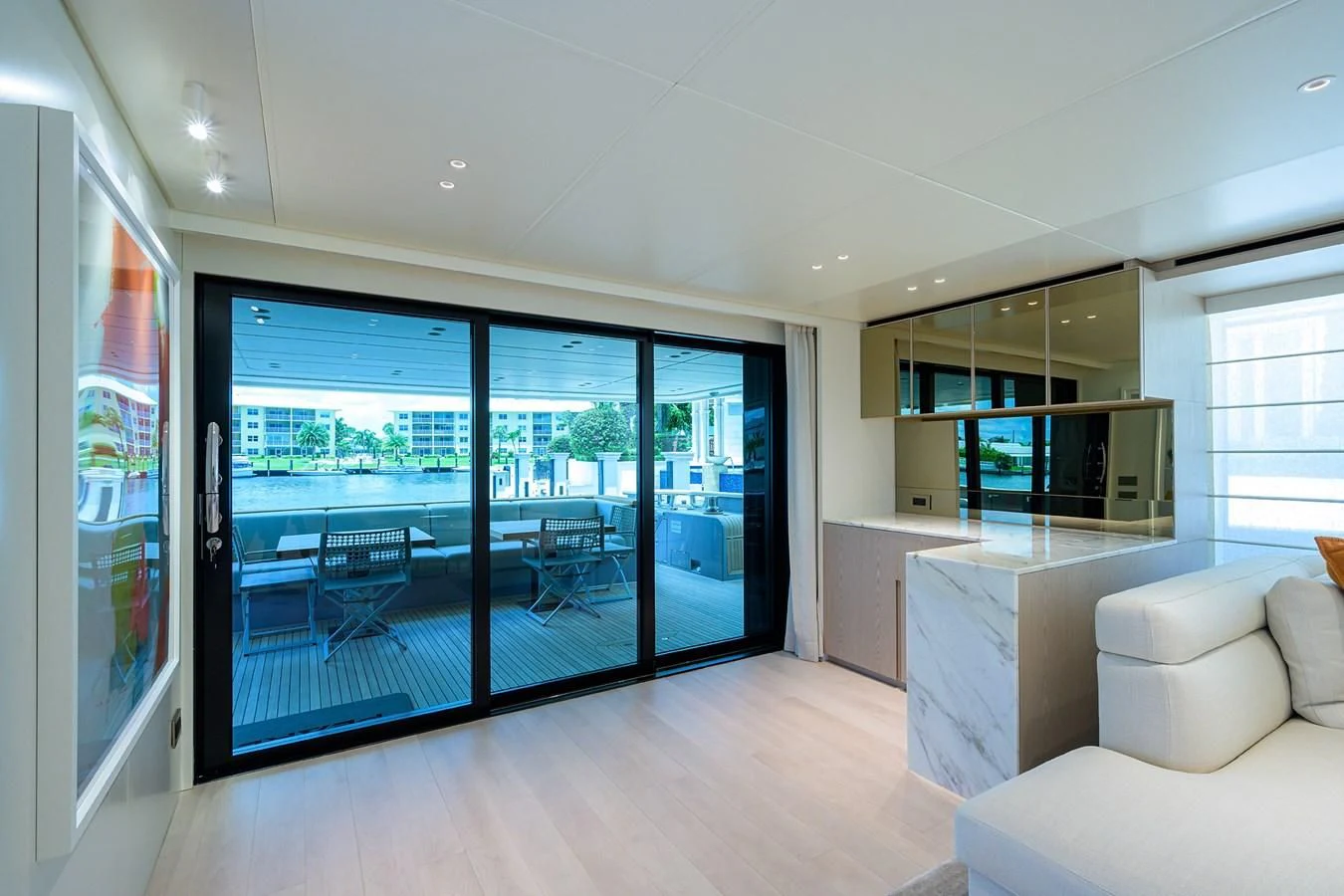 a room with a large glass door and a large window aboard PEARL Yacht for Sale
