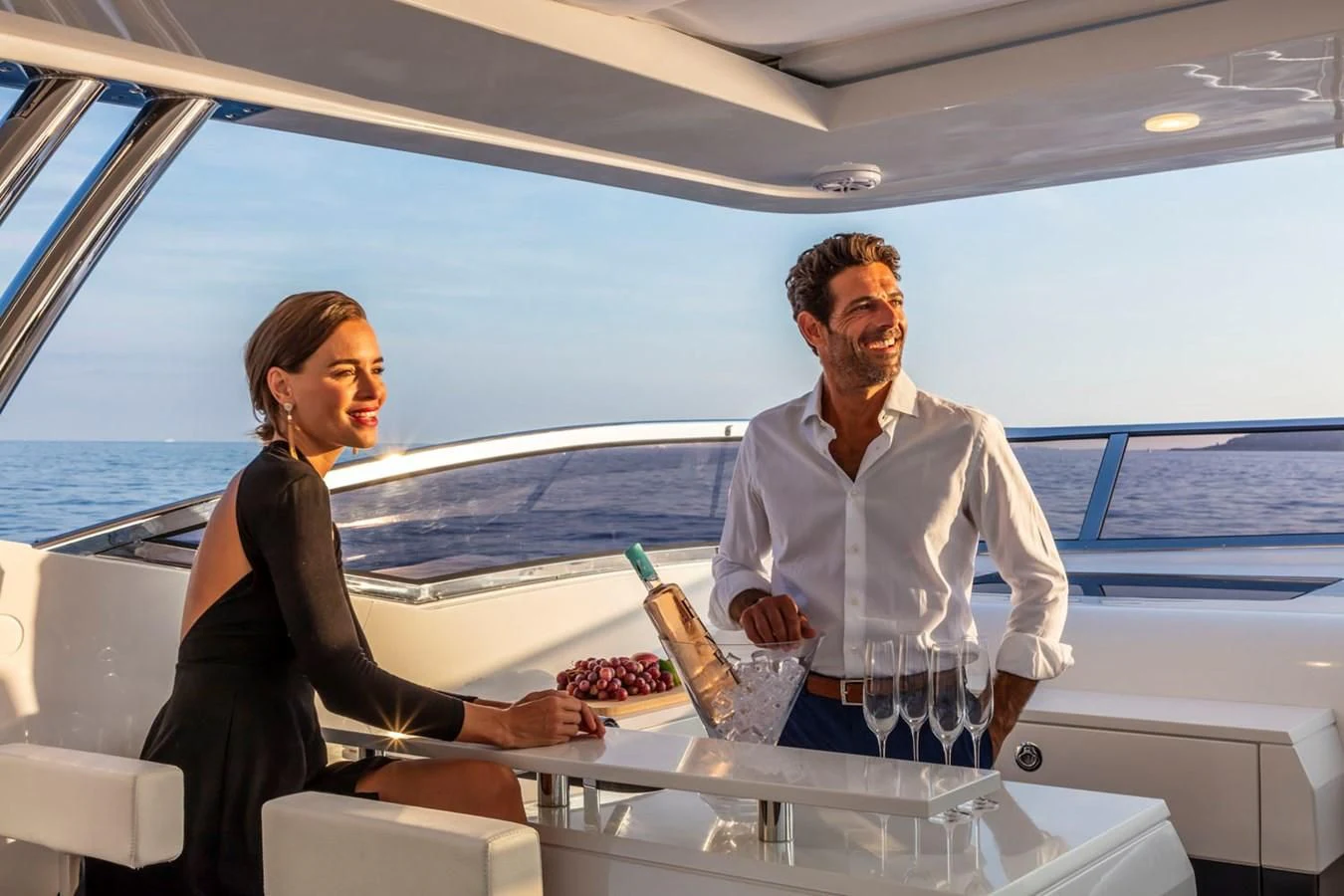 a man and a woman in a boat aboard PEARL Yacht for Sale