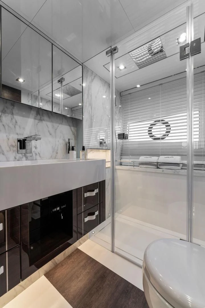 a bathroom with a glass shower aboard PEARL Yacht for Sale