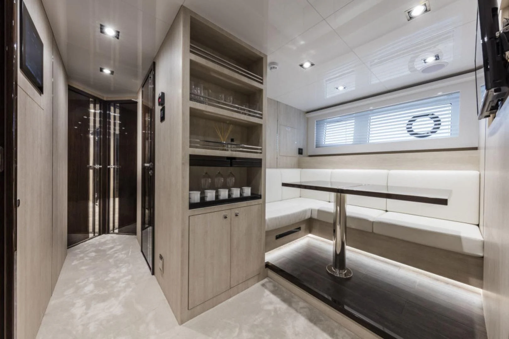 a room with a table and a window aboard PEARL Yacht for Sale