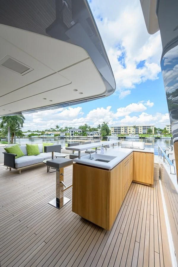 a room with a deck and a view of a city aboard PEARL Yacht for Sale