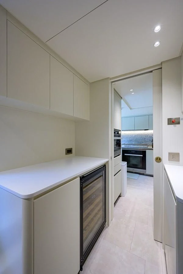 a kitchen with a large window aboard PEARL Yacht for Sale