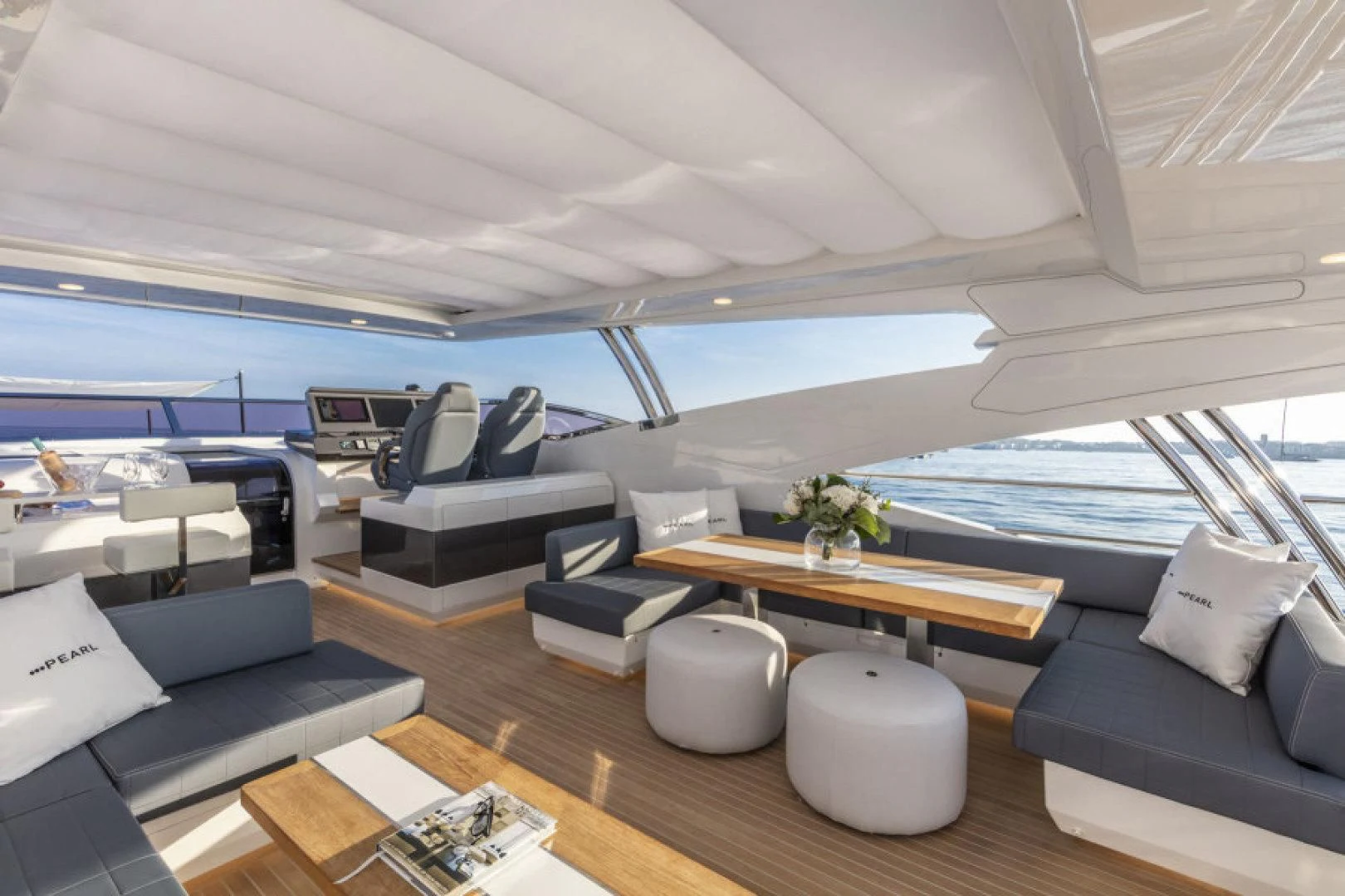 a room with a view of the ocean and the deck aboard PEARL Yacht for Sale