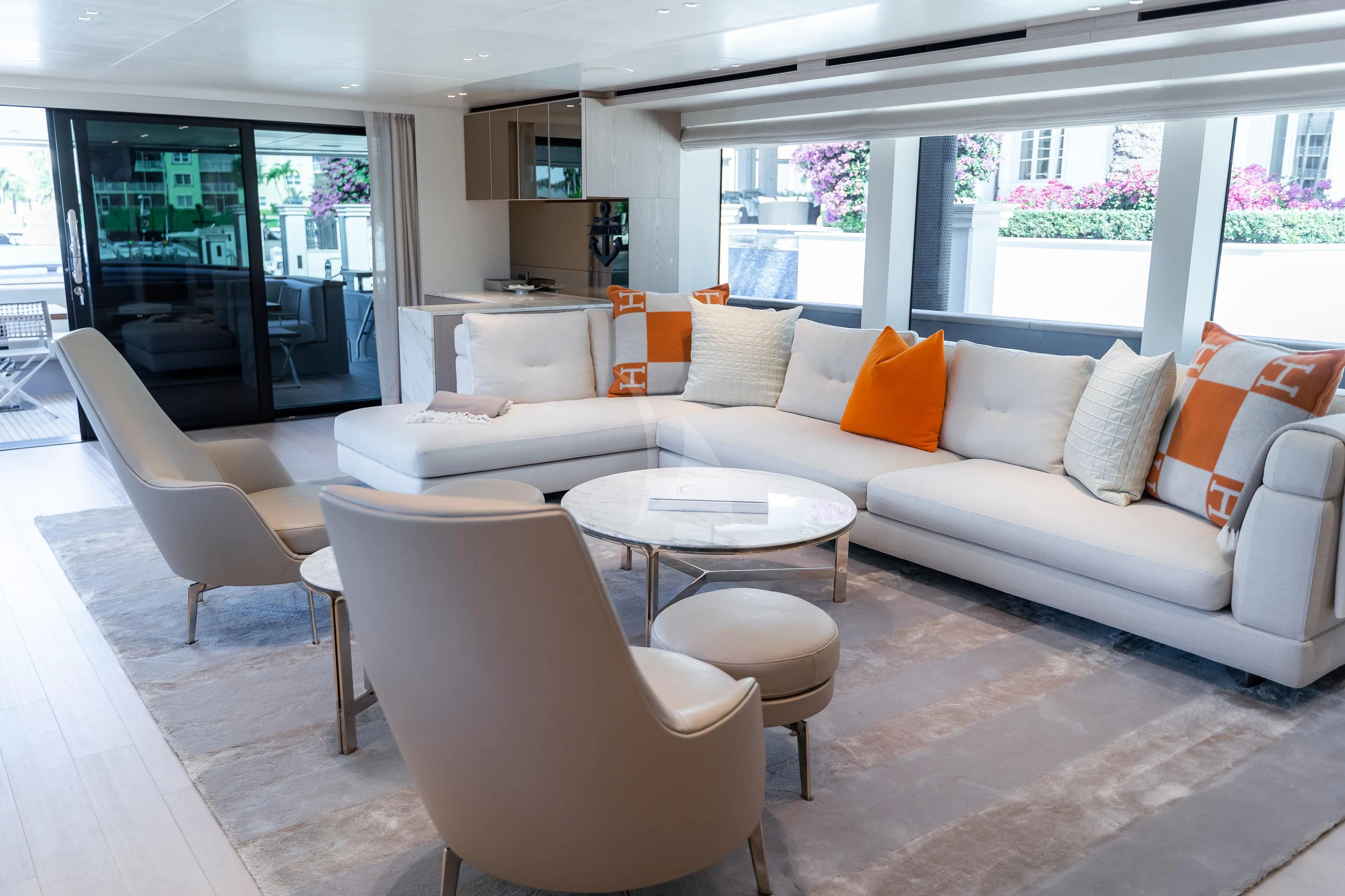 a living room with a couch and a table aboard PEARL Yacht for Sale
