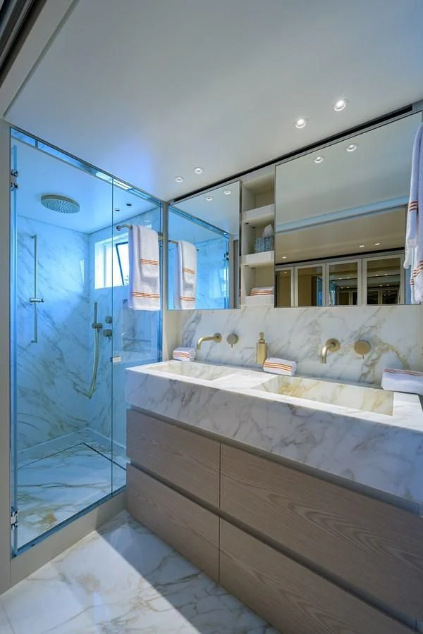 a bathroom with a large mirror aboard PEARL Yacht for Sale