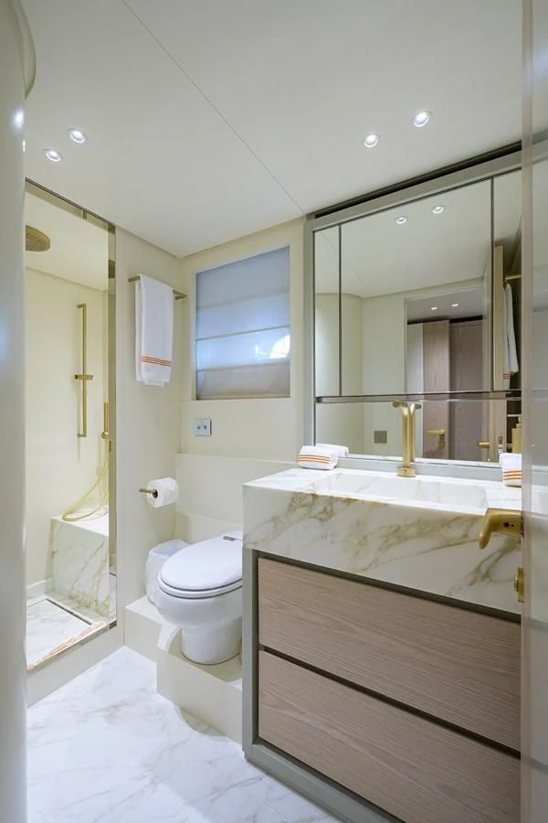 a bathroom with a large mirror aboard PEARL Yacht for Sale