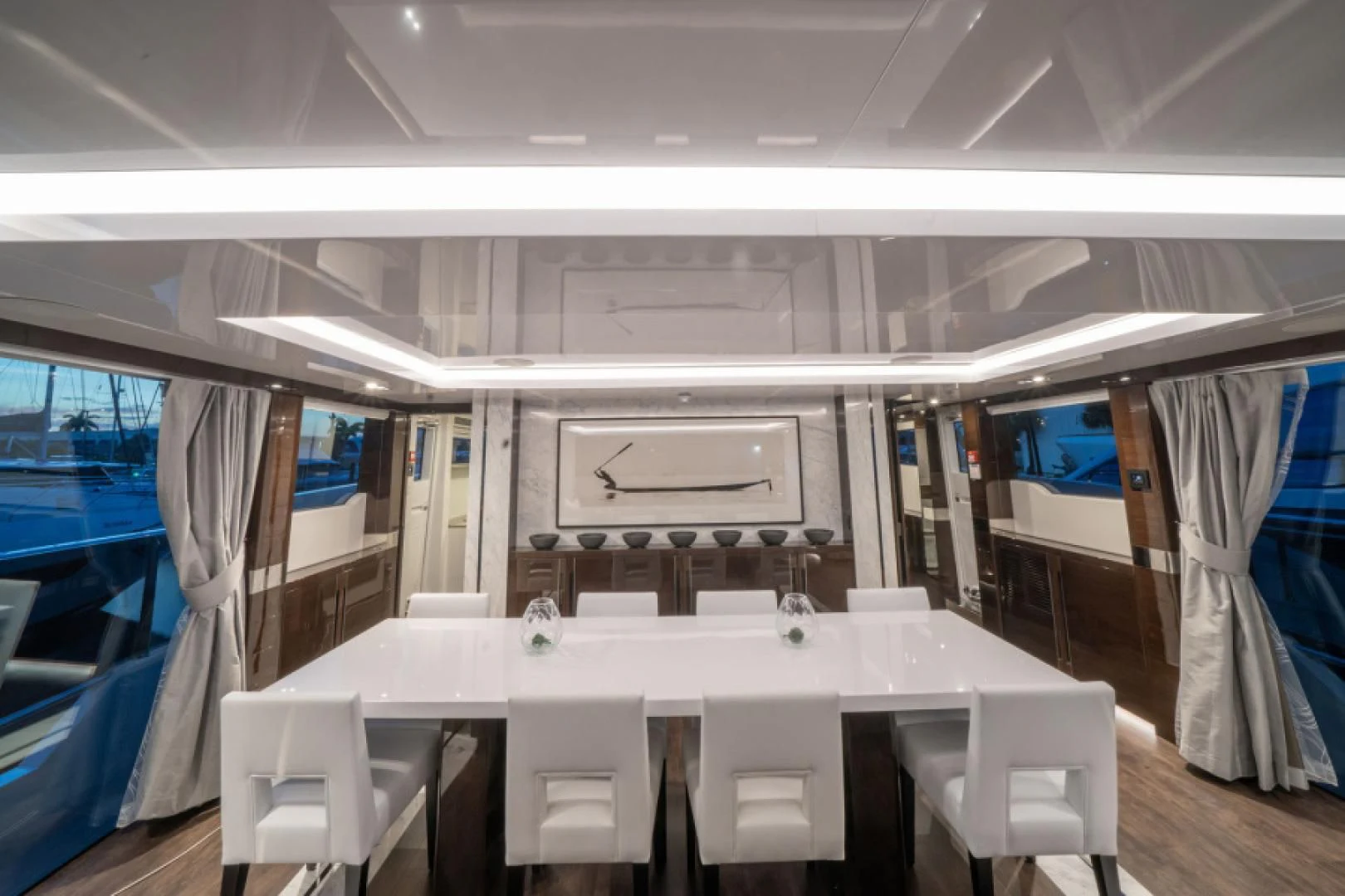a room with a table and chairs aboard PEARL Yacht for Sale