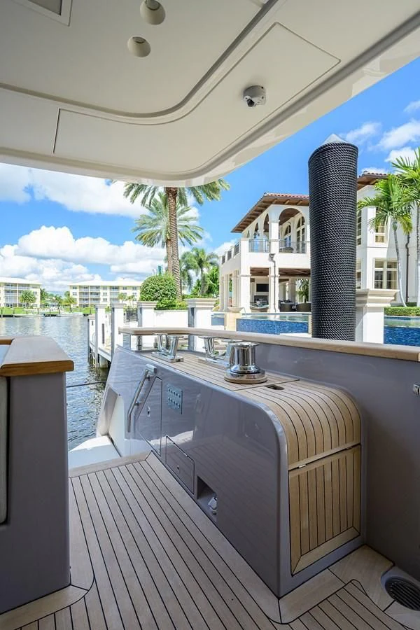 a wooden boat on a body of water aboard PEARL Yacht for Sale