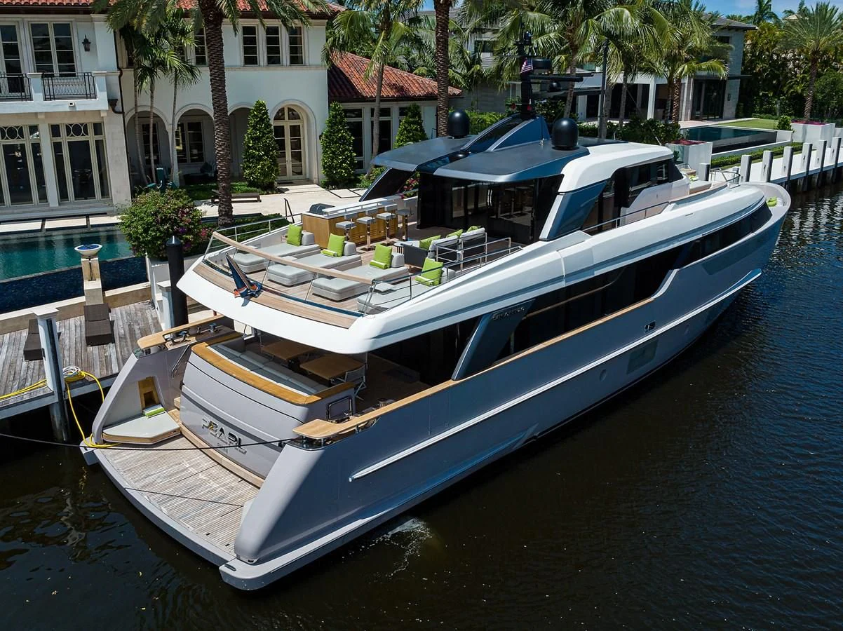 a boat docked at a pier aboard PEARL Yacht for Sale