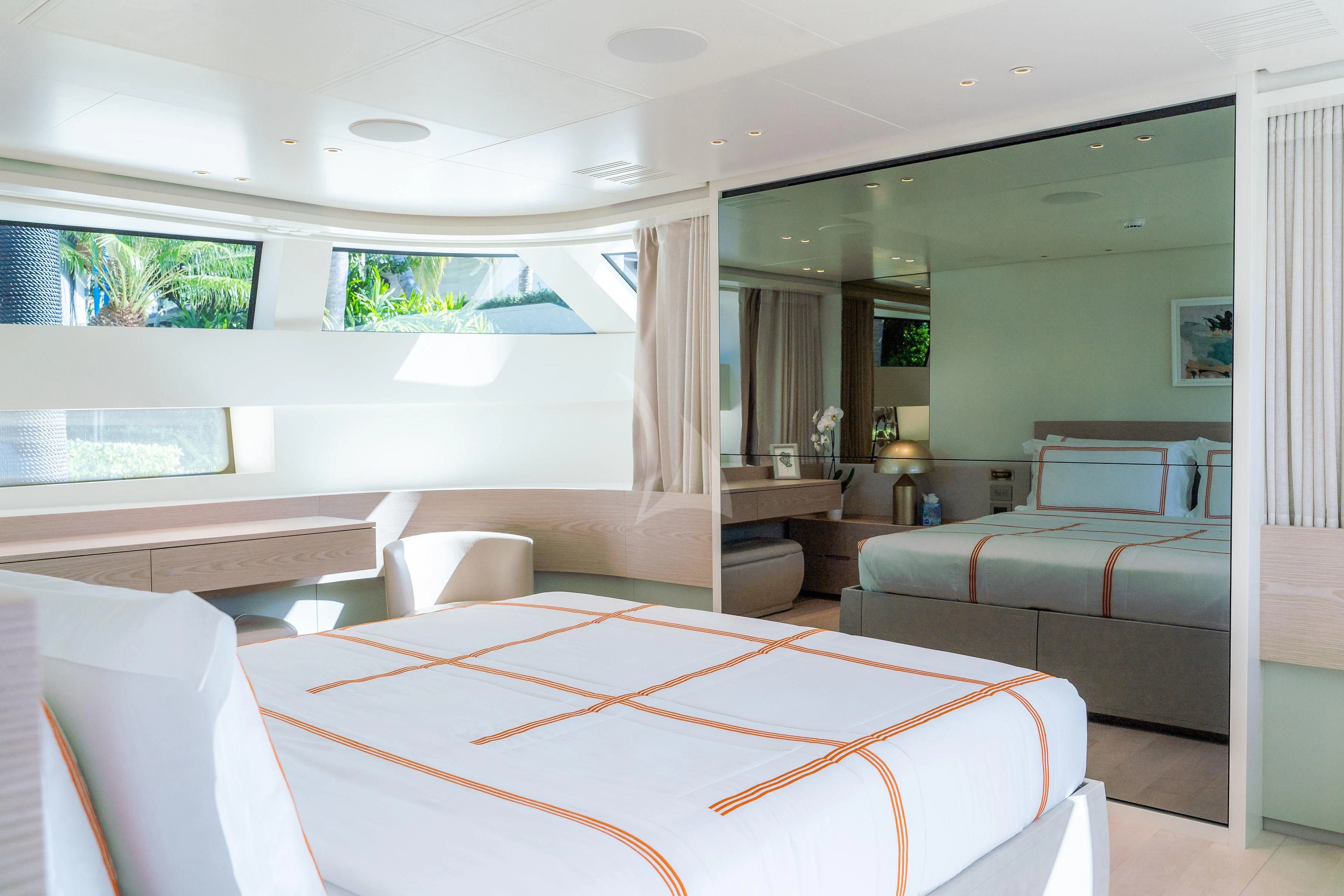 a room with a bed and a couch aboard PEARL Yacht for Sale