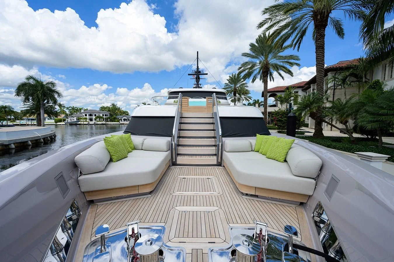 a rooftop with a pool and lounge chairs and trees aboard PEARL Yacht for Sale