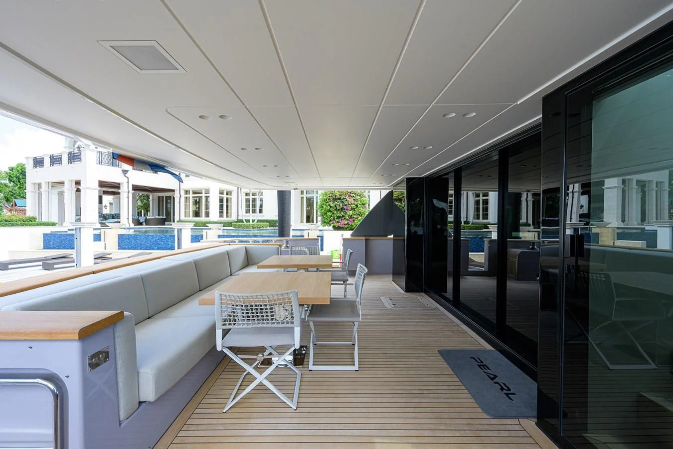 a room with a table and chairs aboard PEARL Yacht for Sale