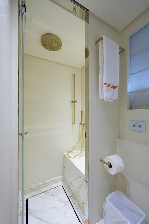 a bathroom with a shower and a sink aboard PEARL Yacht for Sale