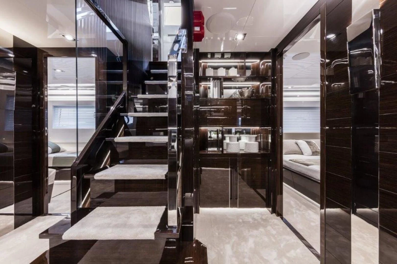 a room with a bed and a large mirror aboard PEARL Yacht for Sale