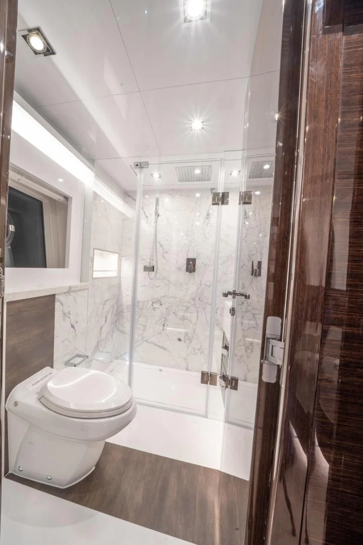 a bathroom with a glass shower aboard PEARL Yacht for Sale