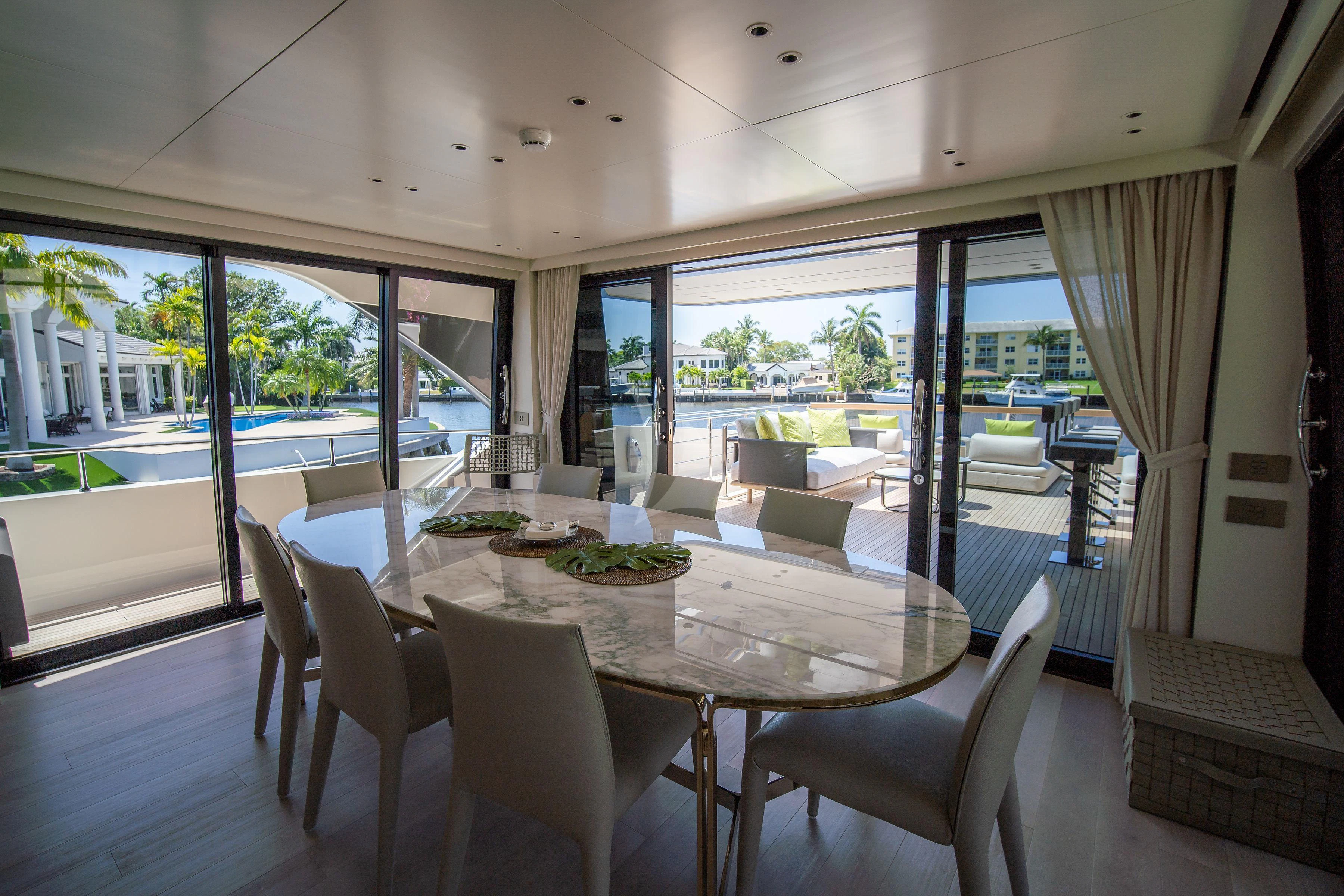 a dining table on a balcony aboard PEARL Yacht for Sale