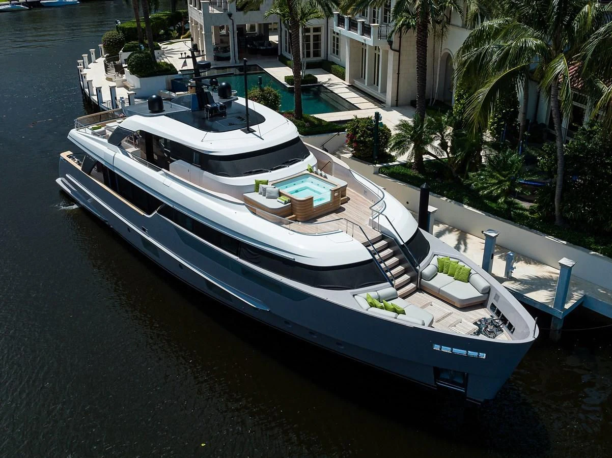 a large boat docked at a pier aboard PEARL Yacht for Sale