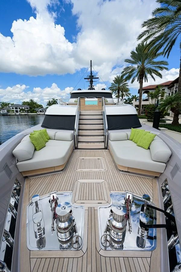a deck with a pool and a boat on it aboard PEARL Yacht for Sale