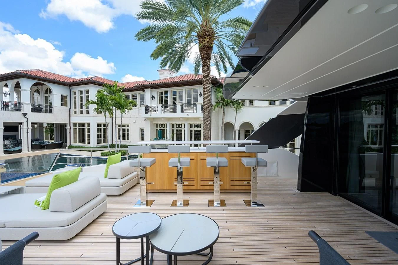 a patio with a table and chairs aboard PEARL Yacht for Sale