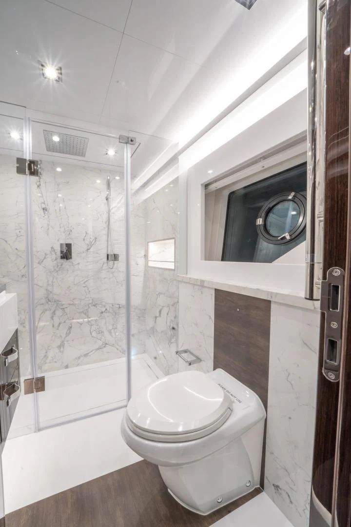 a bathroom with a toilet and a shower aboard PEARL Yacht for Sale