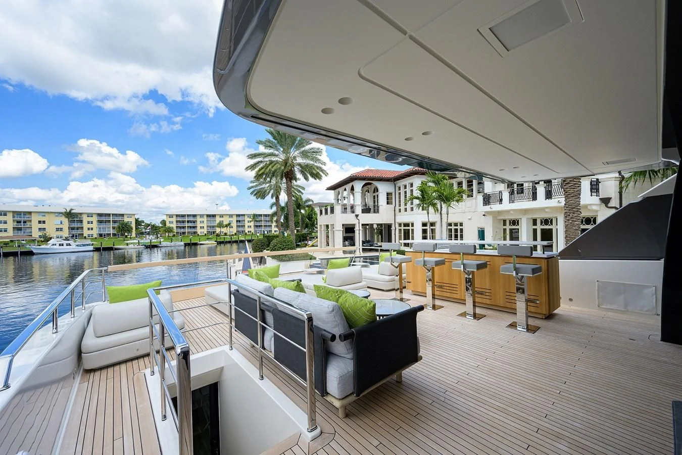 a balcony with a pool and a couch on the deck aboard PEARL Yacht for Sale
