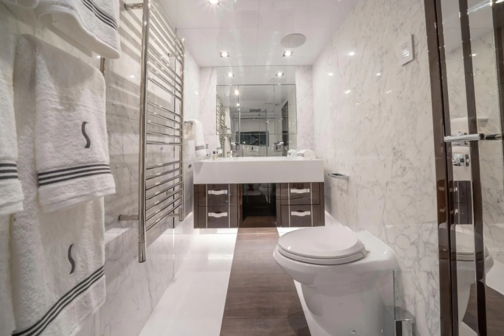a bathroom with a sink toilet and a bathtub aboard PEARL Yacht for Sale