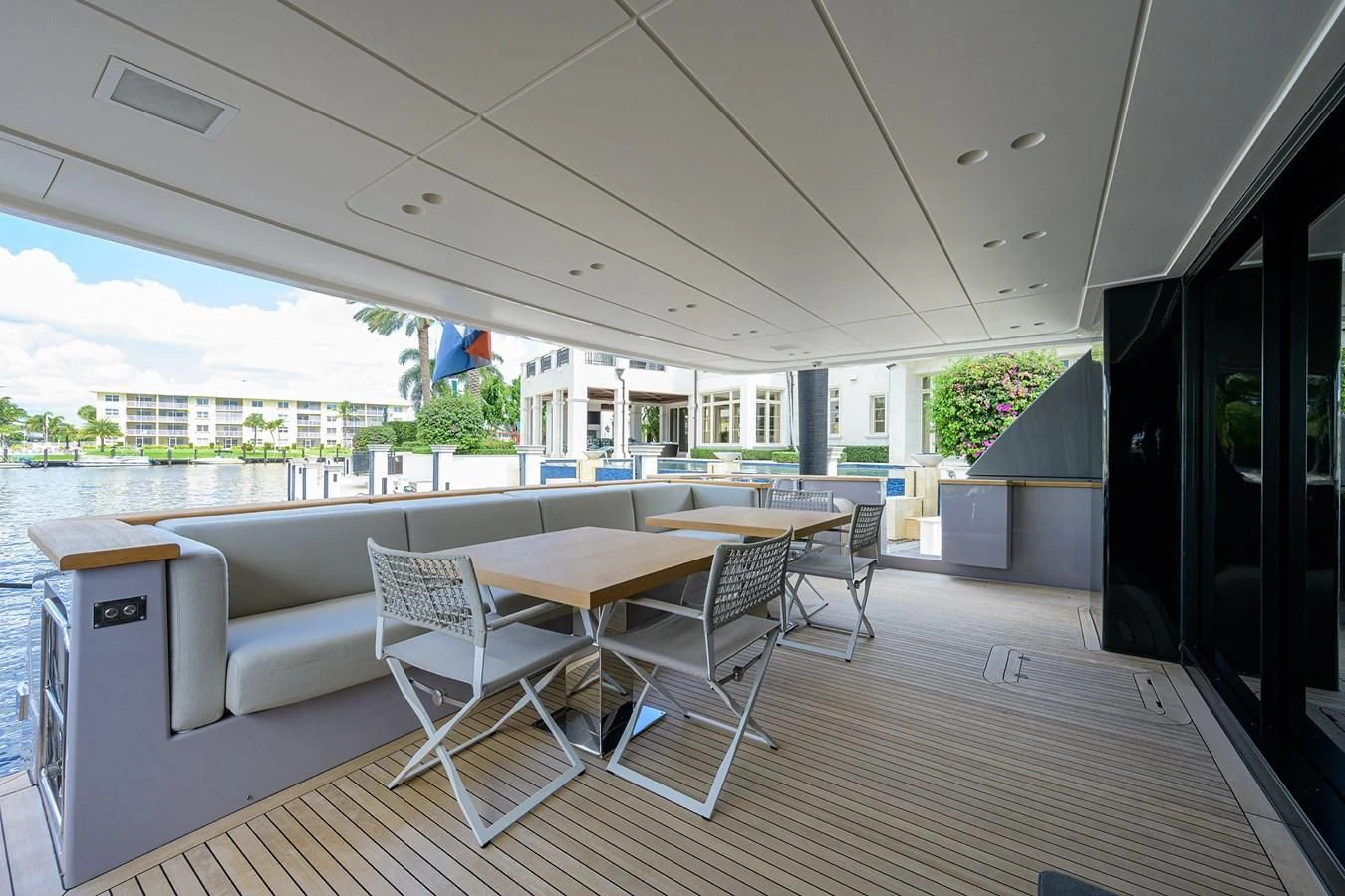 a room with a table and chairs aboard PEARL Yacht for Sale