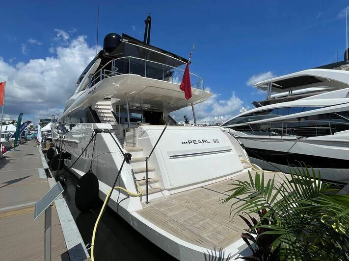 a boat docked at a pier aboard PEARL Yacht for Sale