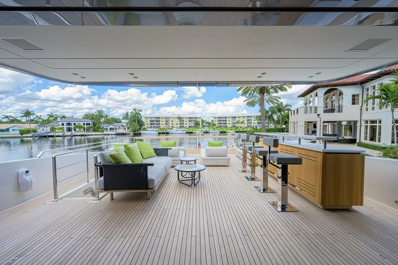 a room with a couch and a table and chairs aboard PEARL Yacht for Sale