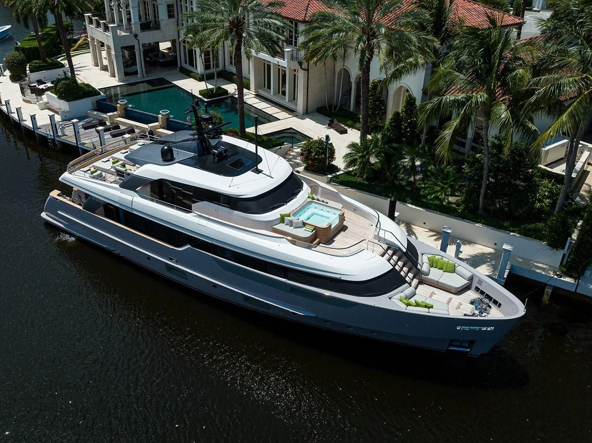 a boat parked on the side of a river aboard PEARL Yacht for Sale