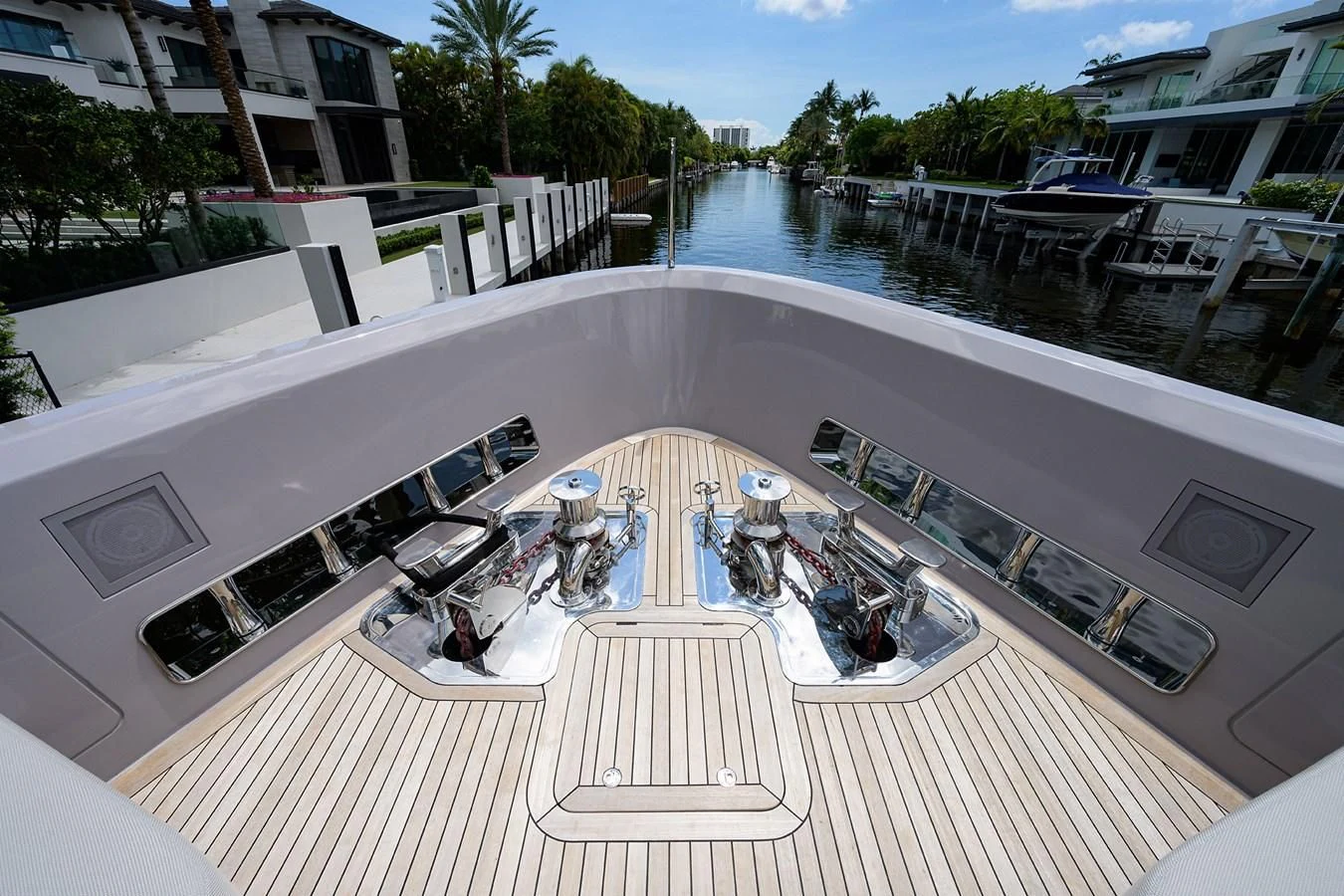 a large pool with a deck and lounge chairs aboard PEARL Yacht for Sale