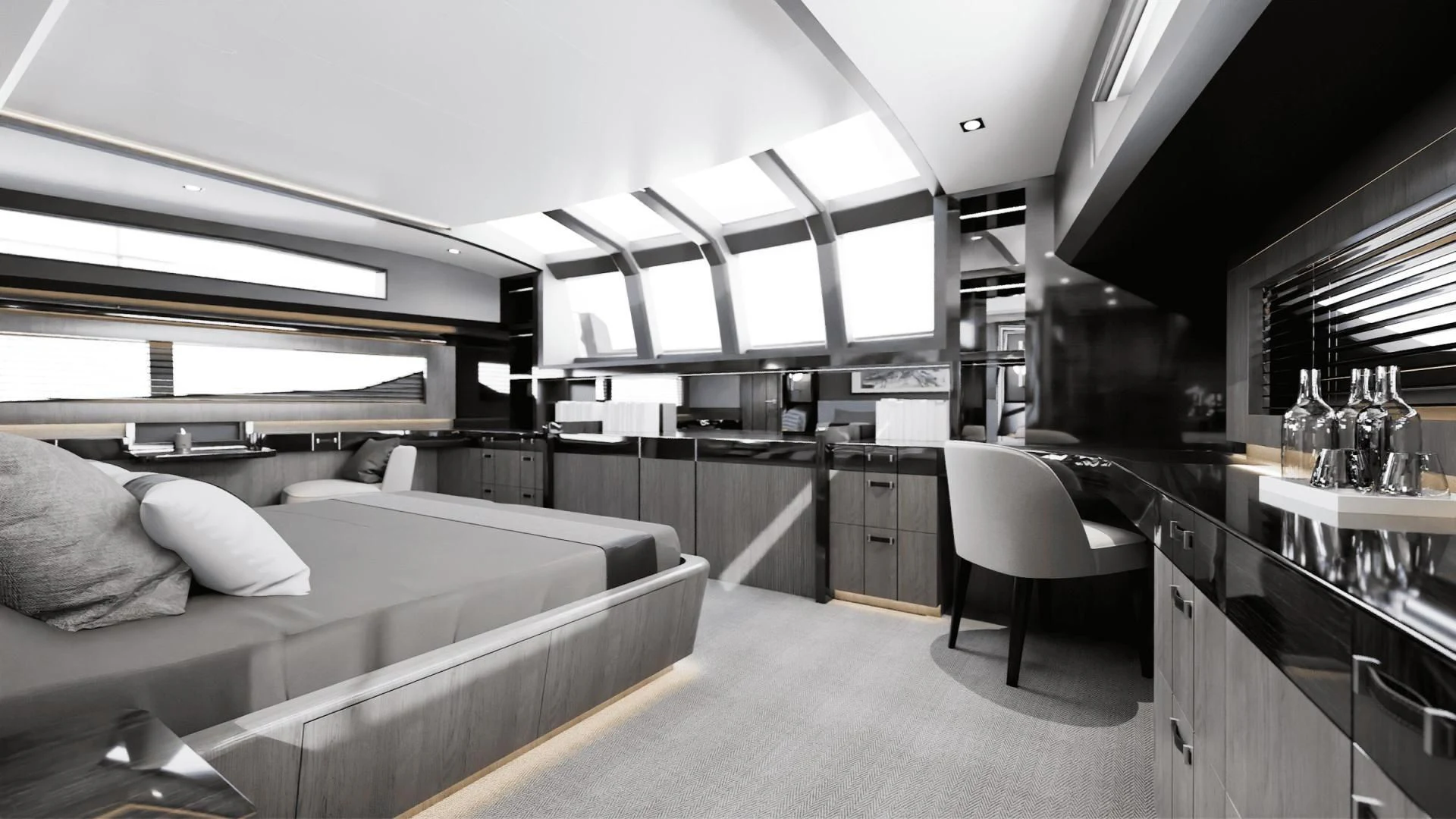 a room with a bed and a desk aboard PEARL Yacht for Sale