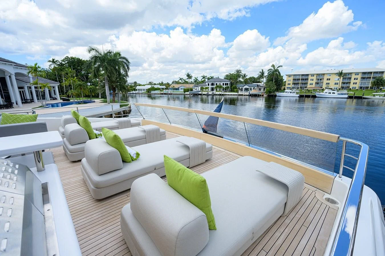 a balcony with chairs and pillows on it aboard PEARL Yacht for Sale