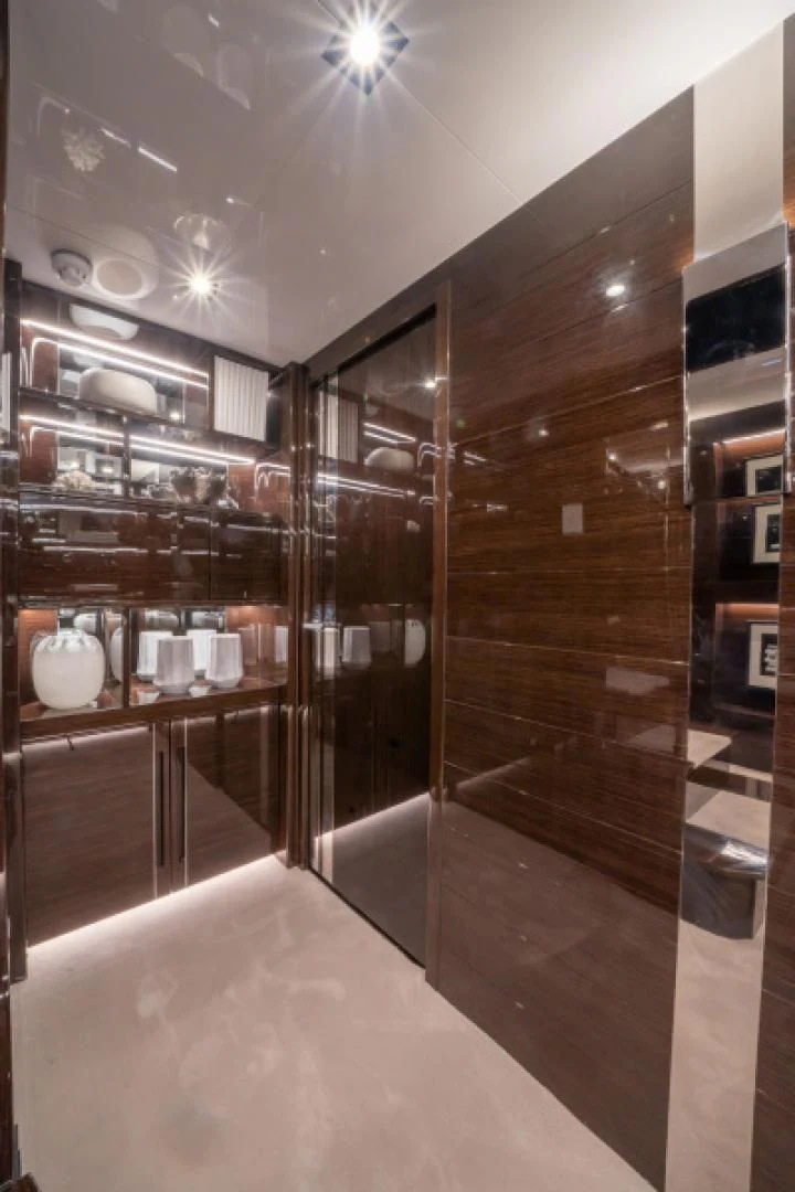a large kitchen with a glass wall aboard PEARL Yacht for Sale