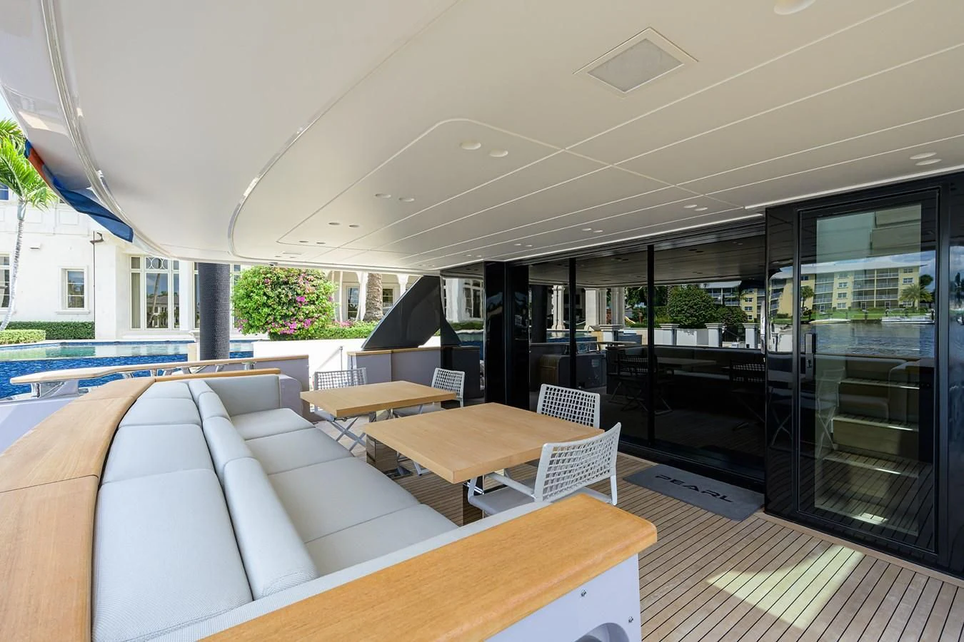 a room with a couch and a pool aboard PEARL Yacht for Sale