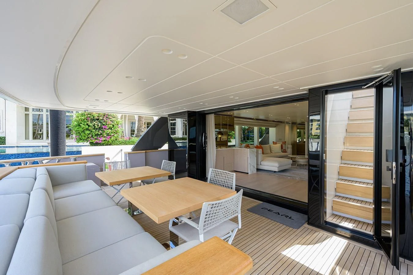a living room with a couch and a table aboard PEARL Yacht for Sale