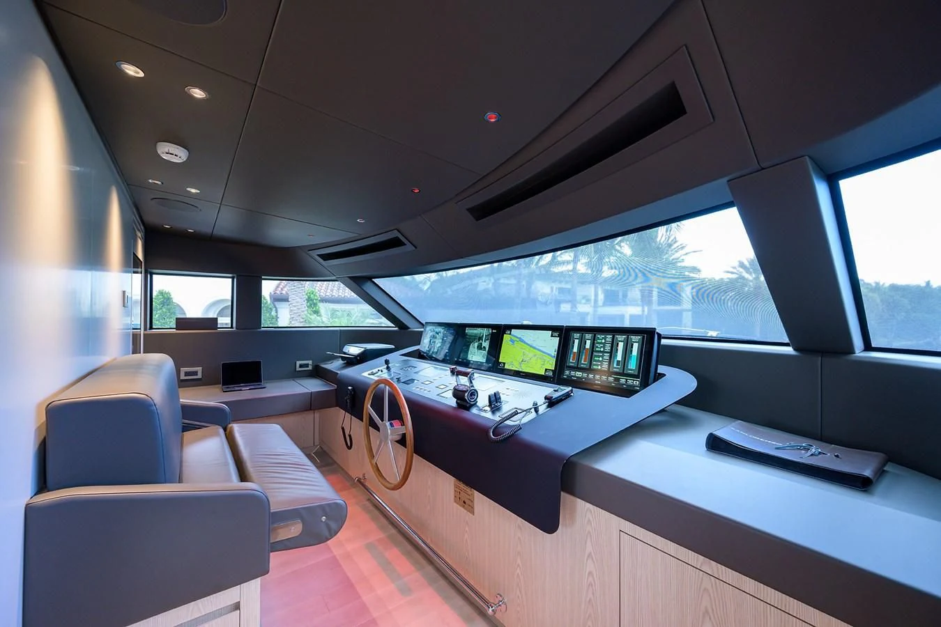a room with a desk and computer aboard PEARL Yacht for Sale