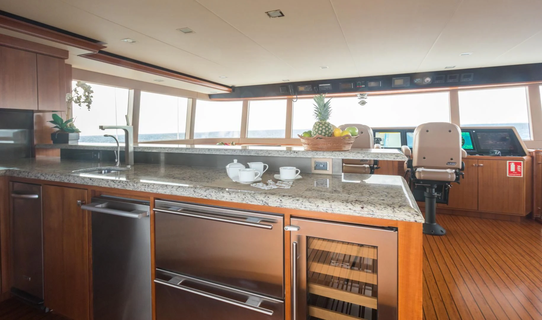 a kitchen with a large island aboard MY AURORA Yacht for Sale