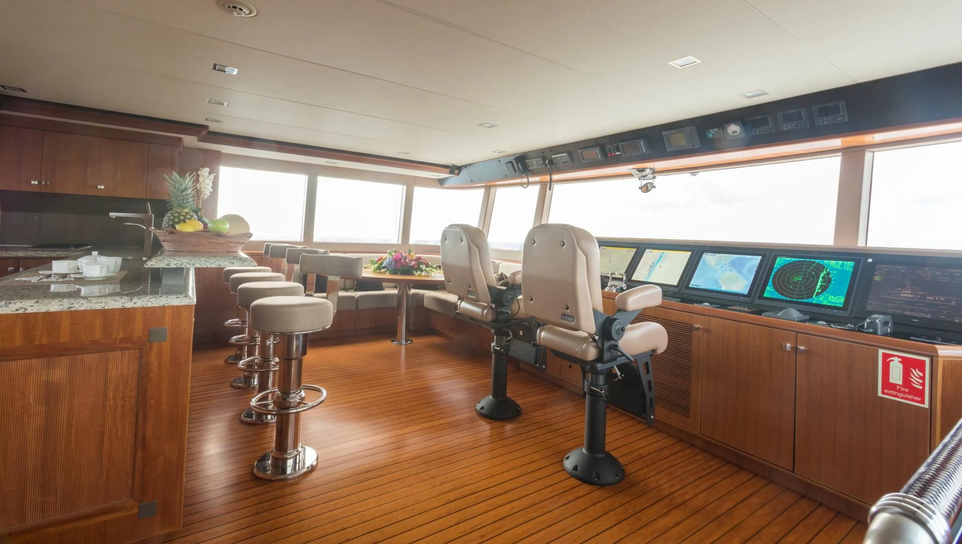 a room with a desk and chairs aboard MY AURORA Yacht for Sale