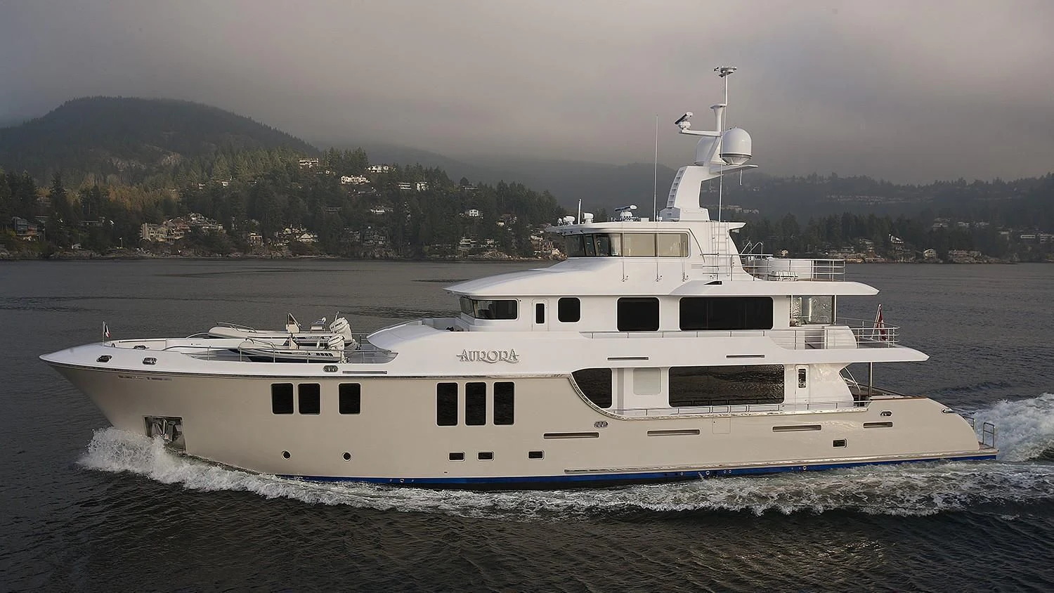 a white boat on the water aboard MY AURORA Yacht for Sale