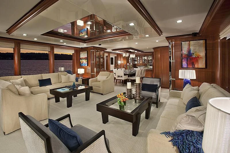 a living room with a couch and a table aboard MY AURORA Yacht for Sale