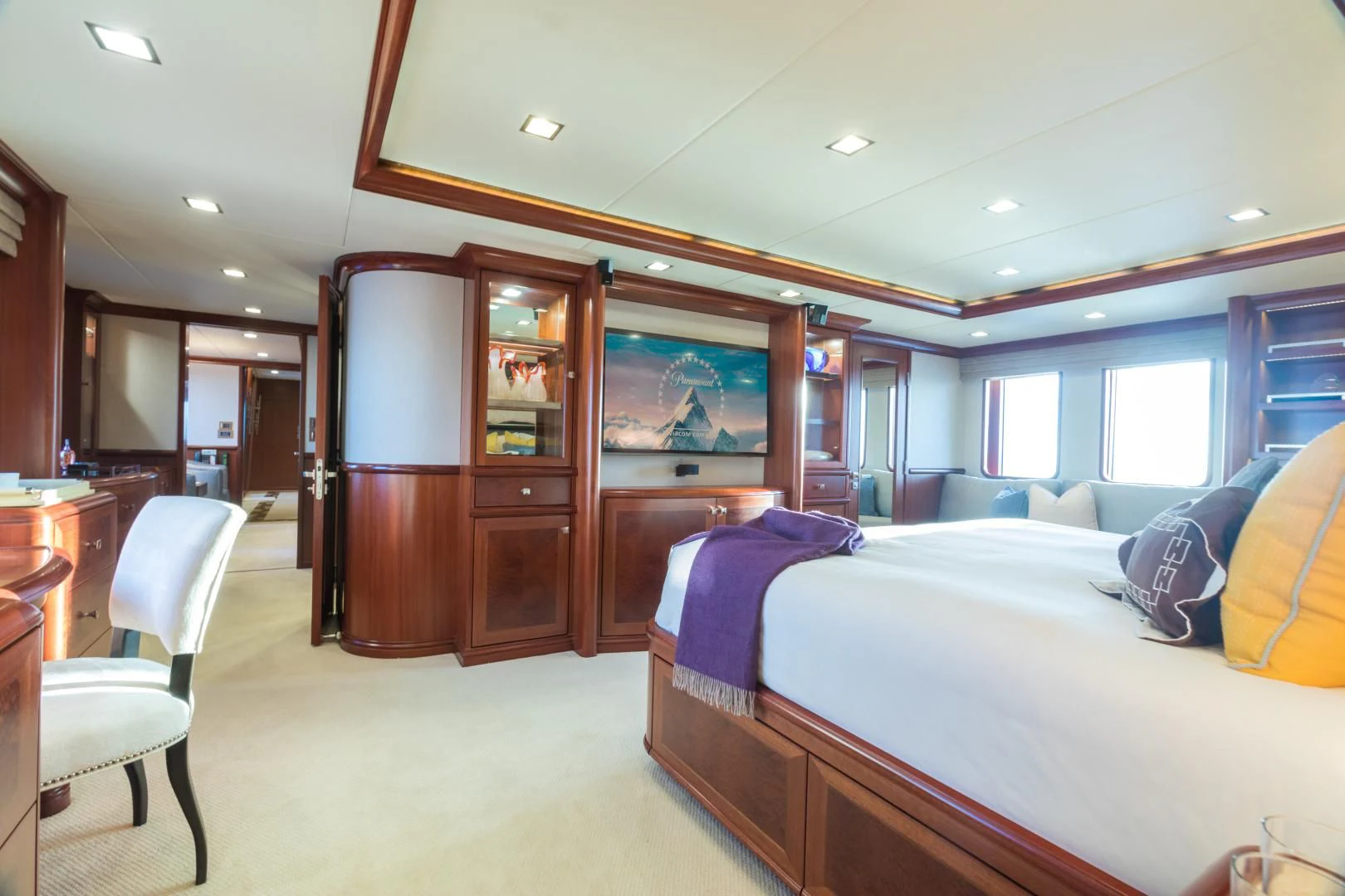 a bedroom with a bed and a desk aboard MY AURORA Yacht for Sale