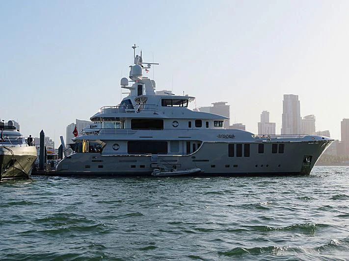 a large white boat in the water aboard MY AURORA Yacht for Sale