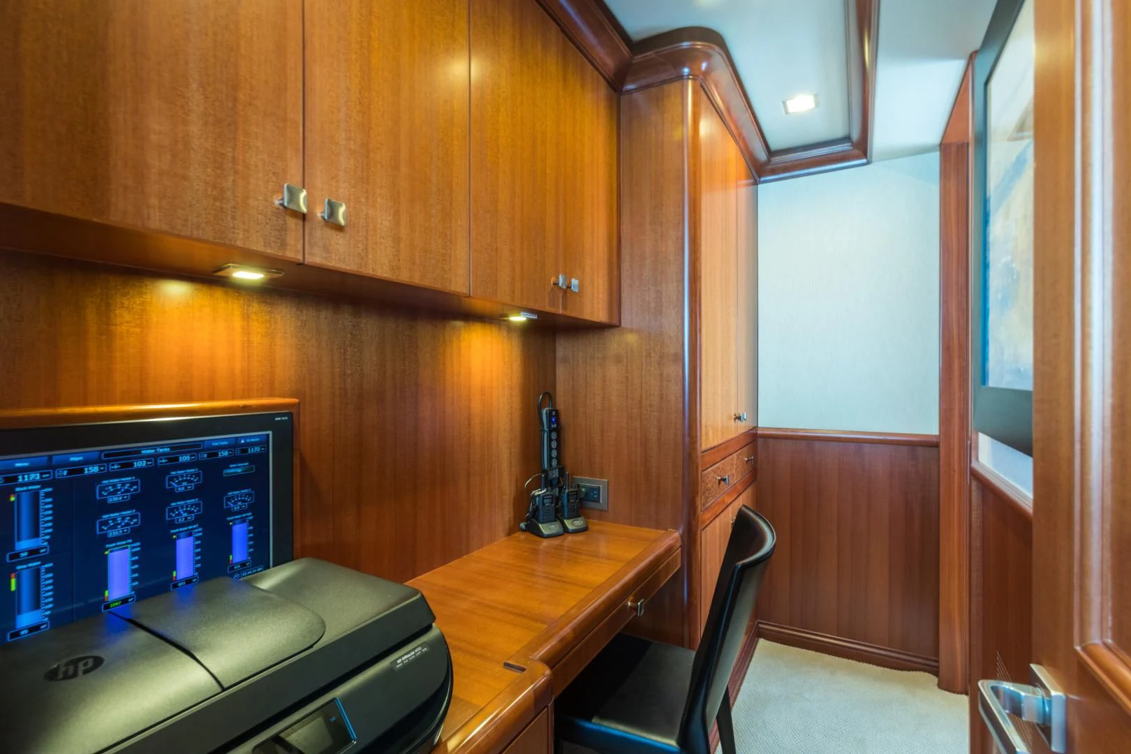a room with a desk and computer aboard MY AURORA Yacht for Sale