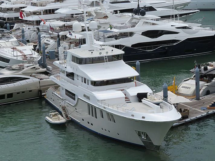 a large white boat in a harbor aboard MY AURORA Yacht for Sale