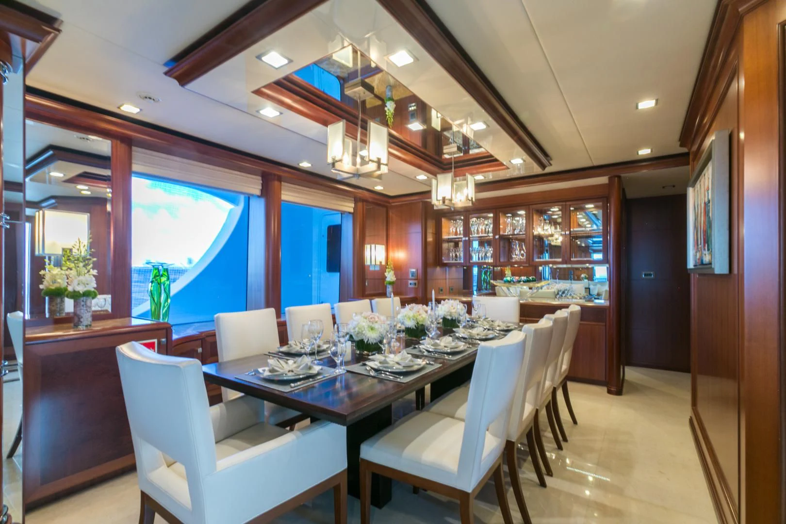 a dining room with a table and chairs aboard MY AURORA Yacht for Sale