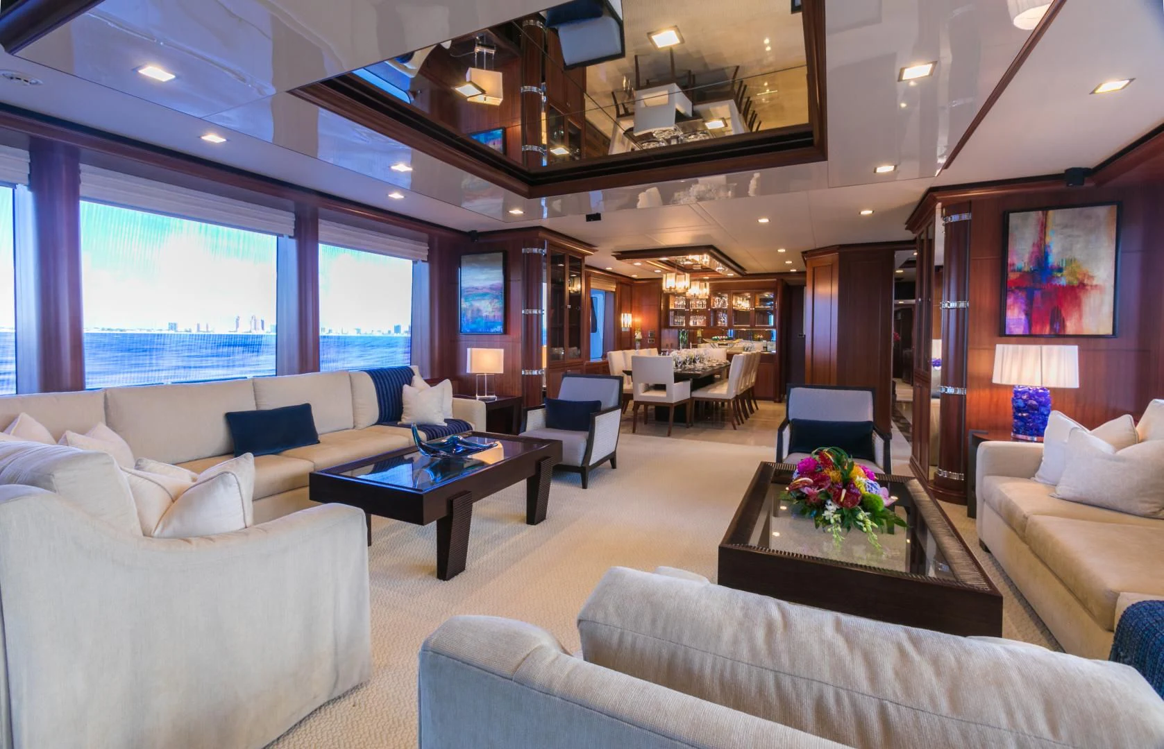 a living room with a large window aboard MY AURORA Yacht for Sale