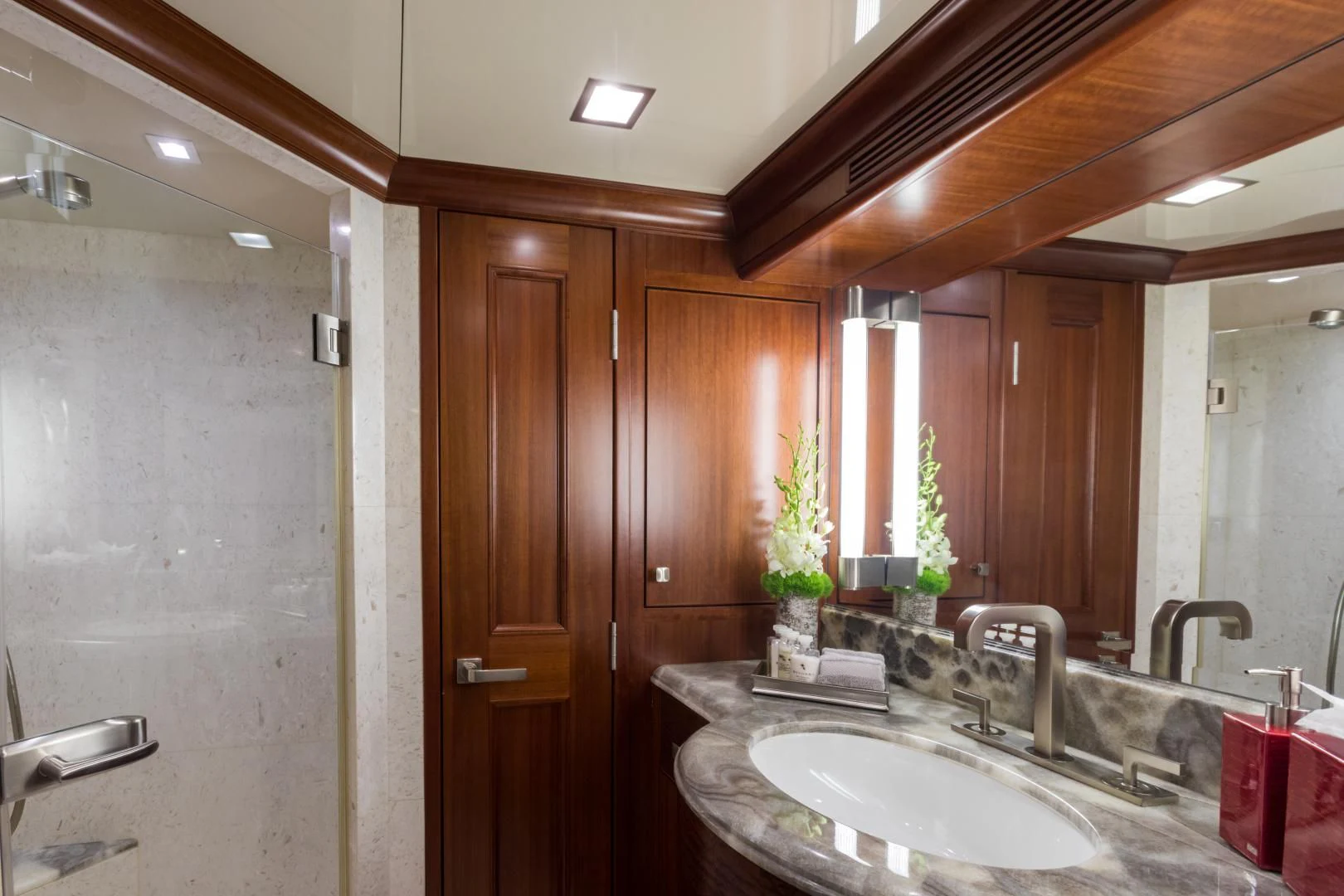 a bathroom with a sink and a mirror aboard MY AURORA Yacht for Sale